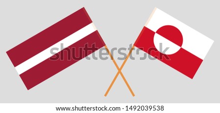 Greenland and Latvia. Crossed Greenlandic and Latvian flags