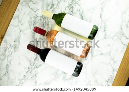 Three bottles of wine with blank labels