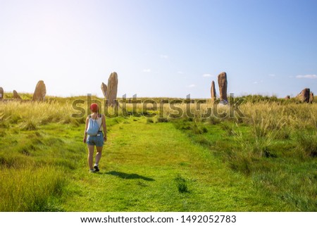 A woman traveling through the Republic of Khakassia in southern Siberia. The Great Salbyk Mound is the biggest archaeological monument in Khakassia Royalty-Free Stock Photo #1492052783