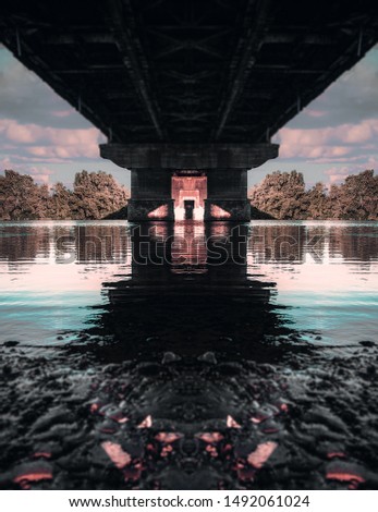 Reflected bridge in water and vertically