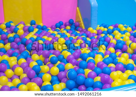 Many colorful plastic balls in a playground