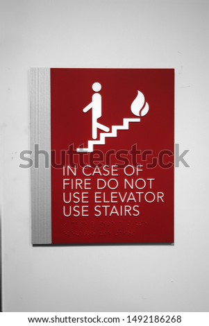 Red sign that says, IN CASE OF FIRE DO NOT USE ELEVATOR USE STAIRS. 