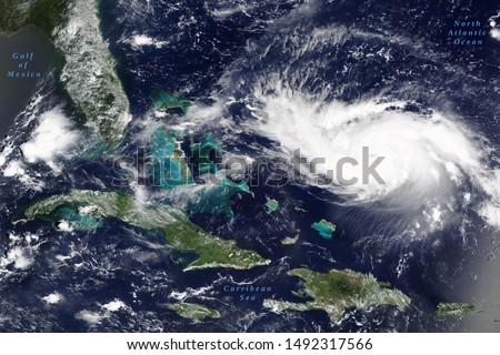 Hurricane Dorian in the Carribean Sea on its way to US mainland in August 2019 - Elements of this image furnished by NASA Royalty-Free Stock Photo #1492317566