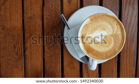 coffee cappuccino on wooden table background isolated