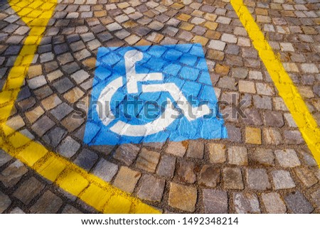 Colorful handicapped parking symbol in Italy