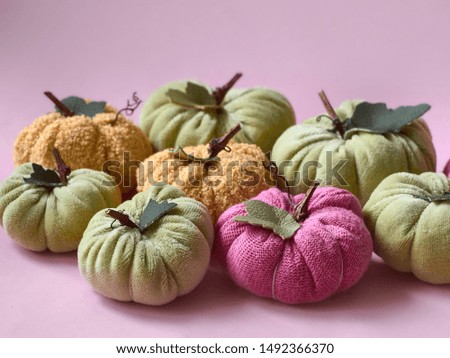 Colorful textile pumpkins for Halloween.