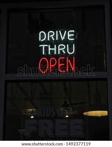 Neon Drive Thru Open Sign in Restaurant Window