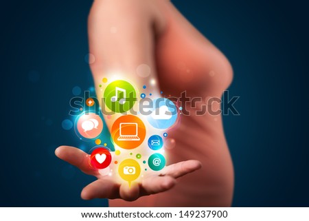 Young beautiful woman presenting colorful technology icons and symbols