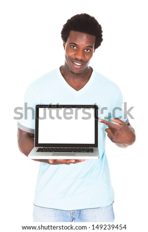 Happy Young African Man Using Laptop Isolated Over White Background