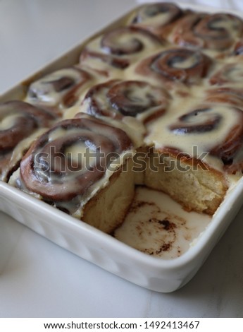 Delicious and festive homemade cinnamon rolls  against white background. Copy space
