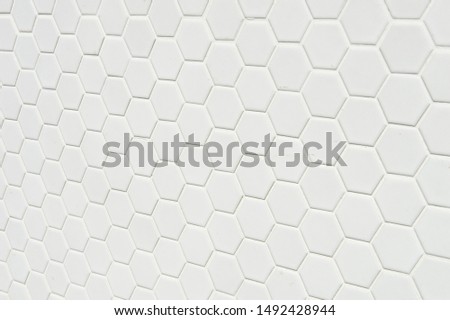 A simple white texture pattern of hexagons as a background