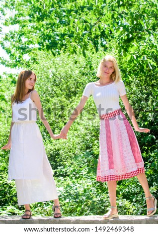 Friendship concept. Revelation and sincerity. Carefree youth friends hang out outdoors. Friendly relations. Summer rest. Girls friends summer dress outfit nature background. Summer vacation and relax.