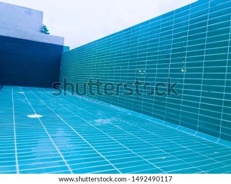 An empty rooftop swimming pool under construction