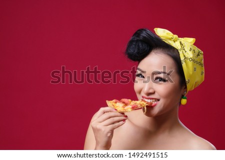 Woman eating pizza on a red background, eating, tasty