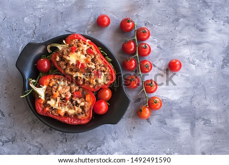 Stuffed peppers minced meat with vegetables in the Mexican style. Bulgarian pepper. The view from the top. The view from the top. National cuisine Royalty-Free Stock Photo #1492491590