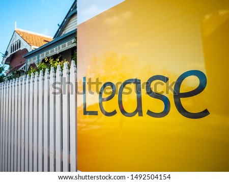 Sign of 'Lease' at front of old residential house. Melbourne, VIC Australia.