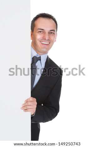 Happy Businessman Holding Placard Over White Background