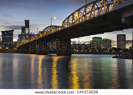 Portland Oregon City Skyline Under Hawthorne Bridge by the Bank of Willamette River at Dusk