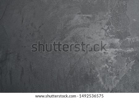 texture of dark gray wall with decorative plaster concrete effect