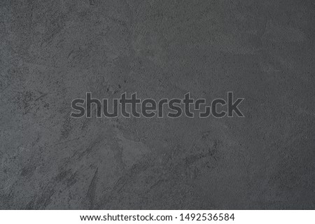 texture of dark gray wall with decorative plaster concrete effect Royalty-Free Stock Photo #1492536584