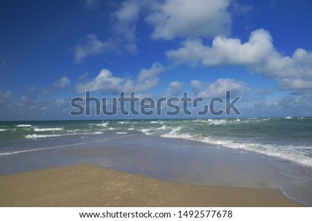 Grenen beach near to Skagen in northern Denmark. The junction between the strait of Skagerrak (part of the North Sea) and the Kattegat sea (Baltic sea) Royalty-Free Stock Photo #1492577678