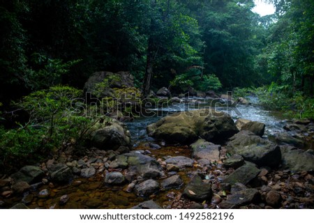 Natural waterfall, shoulder river, through the top of the mountain
