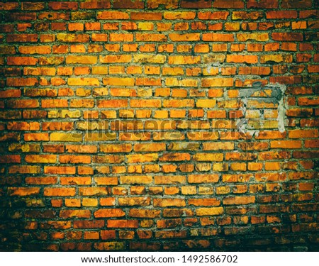 brick wall or surface with vignetting or darkened edges, background