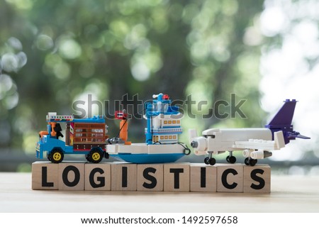 Miniature toy of transport in Thailand (farming trucks, ship, and plane) with wooden block world logistics. Cargo delivery concept banner
