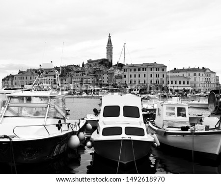 A photo of beautiful view on old town and Church of St. Euphemia for tourists in Rovinj, Croatia on summer sunny day. Rovinj is a European town in Istria, on sea side.