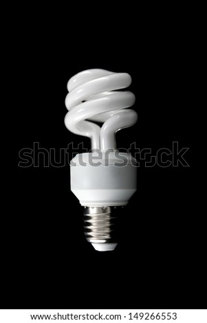 Energy-efficient CFL bulb on black background  , power and energy concept                    