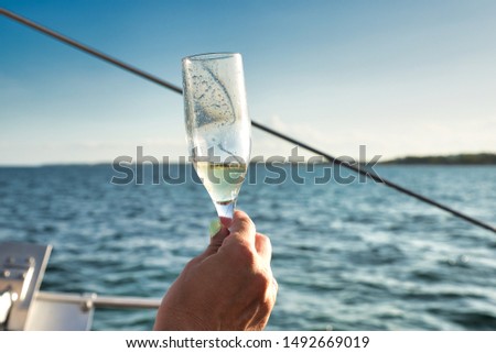 Drinking Champagne in a Catamaran ride. Royalty-Free Stock Photo #1492669019