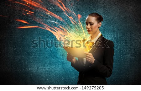 Image of young business woman holding ipad
