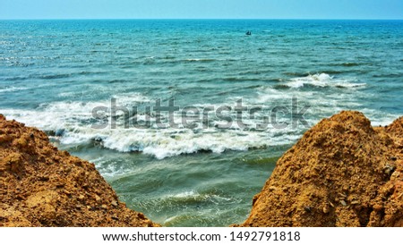 Seascape. Surf. Waves breaking on a seashore. Marine background.  Panoramic skyline. Travel and vacation