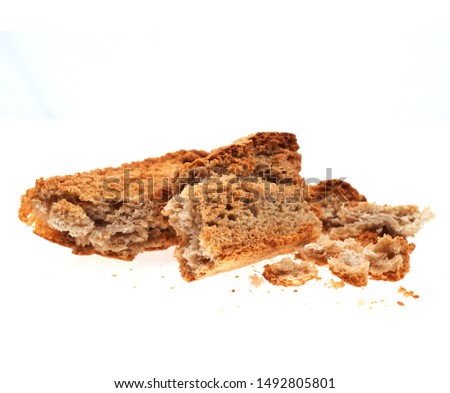 dried slice of bread isolated on white background.                            