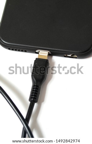 A wire to charge the phone on a white background.