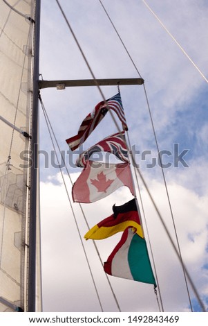 North American and European flags on boat