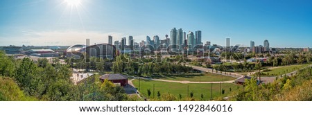 Beautiful Calgary city skyline from scotsman’s hill on a sunny day, Canada. Shining Sun. Panarama 2019 Royalty-Free Stock Photo #1492846016