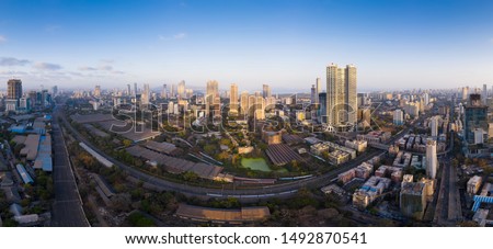 A panoramic cityscape of Mumbai with Parel, Lalbaug and Lower Parel in frame. Also seen are the western and central railway lines. Royalty-Free Stock Photo #1492870541