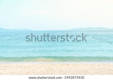 Soft blue ocean wave on sandy beach. Background. Sky and sea.