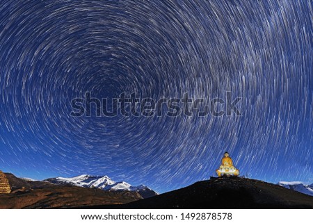 A start trail scape from the Spiti Valley, Himalayas - 120 images stacked. BG got lit with moon light Royalty-Free Stock Photo #1492878578
