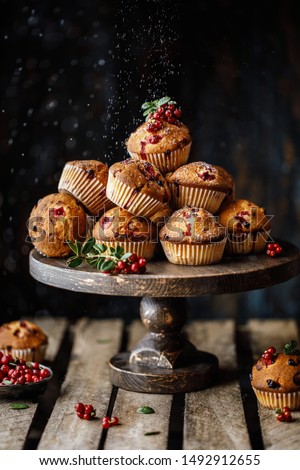 Freshly baked cowberry muffins. Cranberry muffins with fresh berries on rustic background. Copy space. Royalty-Free Stock Photo #1492912655