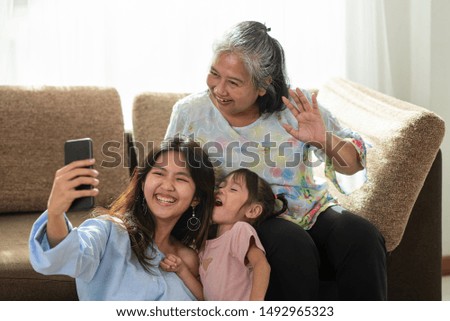 Happy Asian family selfie in their house, love and happiness people concept with home