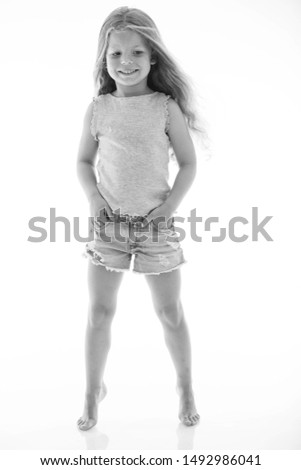 Little girl black-and-white photo. Fashionable little girl. Children's fashion. 