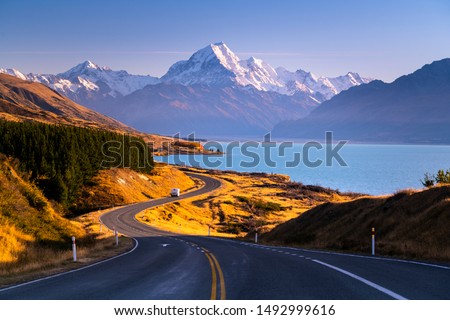 Taken on the road next to Peter's lookout looking towards Mount Cook in the distance on a beautiful clear Autumn day in New Zealand. Royalty-Free Stock Photo #1492999616