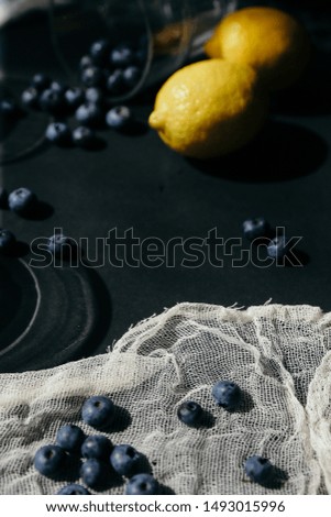 Vertical flatlay with lemons and blueberry