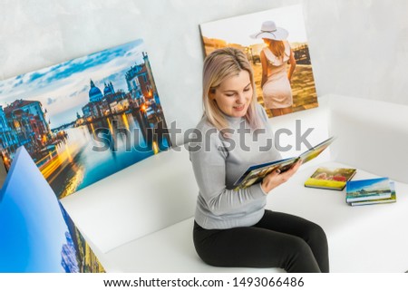 woman in studio with photo canvas