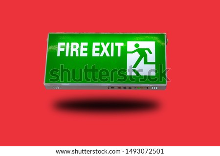 Emergency exit, green sign, isolated from background