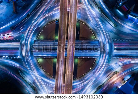 Circle of Traffic light tail seem like electron that is a heart of infrastructure road and economic system transportation and communication Royalty-Free Stock Photo #1493102030