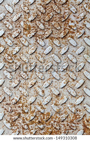 Rusted gray diamond metal plate background texture