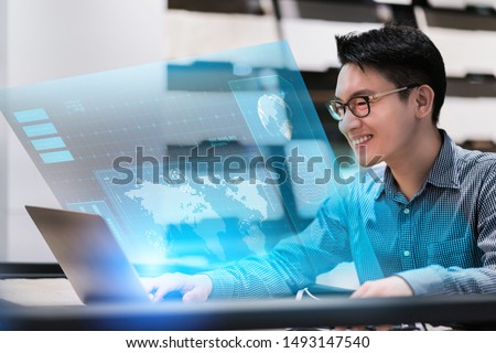 asian business male professional owner entrepreneur work and leading executive in the business empire modern office hand touch monitor virtual screen digital technology